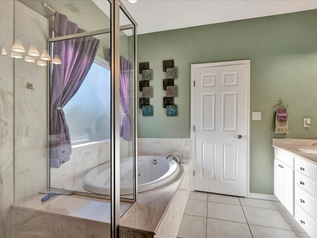 bathroom featuring tile patterned floors, separate shower and tub, and vanity