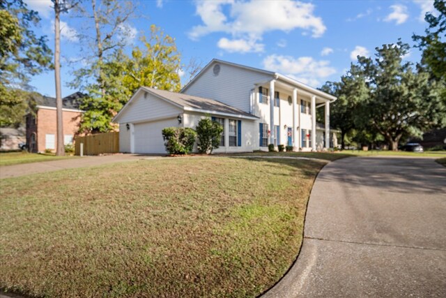 rear view of property featuring a lawn, central AC, a patio, and french doors