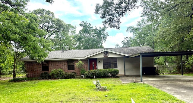 ranch-style home with a front lawn, driveway, a carport, and fence