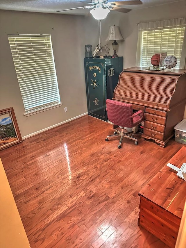 office area with hardwood / wood-style flooring and ceiling fan