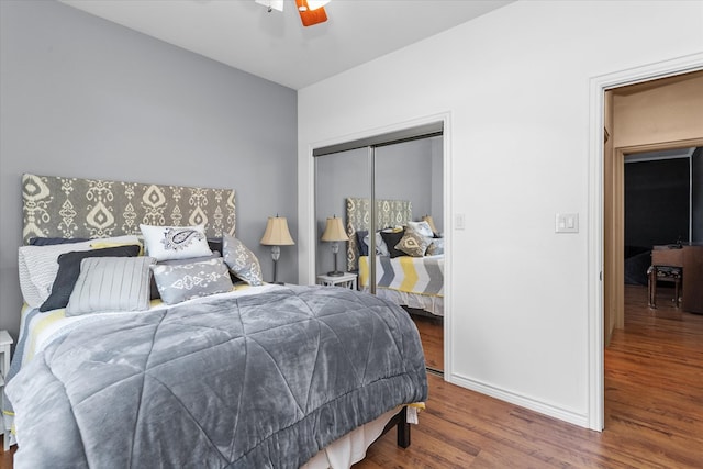 bedroom featuring a closet, ceiling fan, and hardwood / wood-style flooring