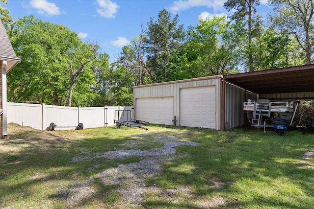 garage with a yard and a carport