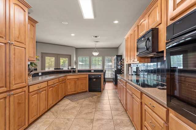 kitchen with black appliances, crown molding, sink, hanging light fixtures, and light tile patterned floors