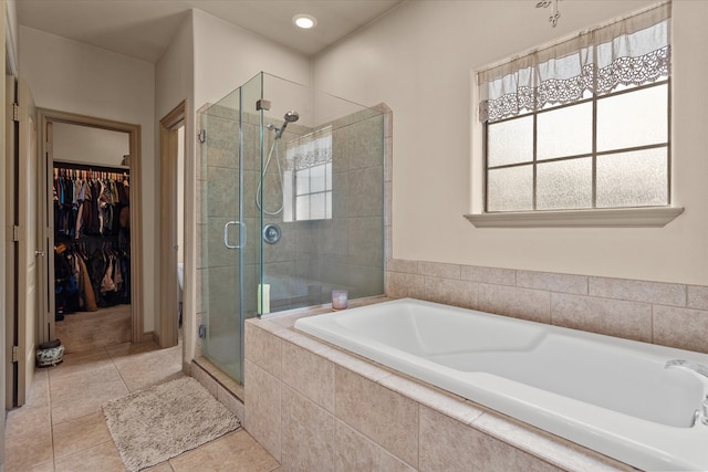 bathroom featuring shower with separate bathtub and tile patterned floors