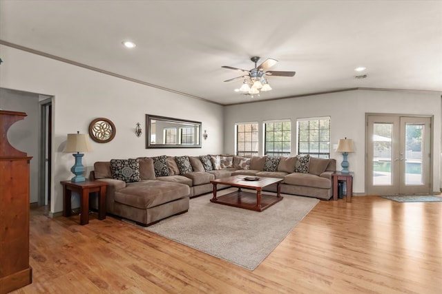 living room featuring ceiling fan, french doors, crown molding, and light hardwood / wood-style flooring