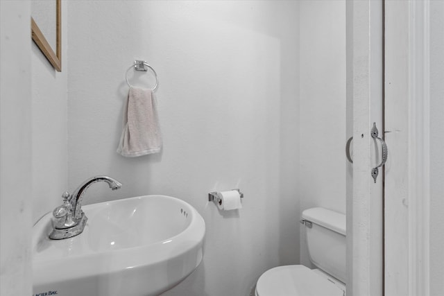 bathroom with toilet and sink