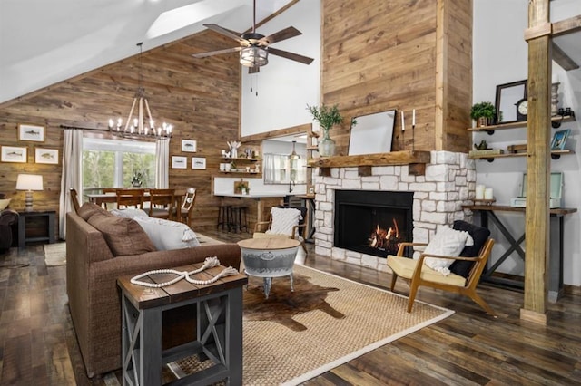 3535 Fm 1007, Brookeland, TX 75931 - living area with wood walls, a stone fireplace, high vaulted ceiling, wood finished floors, and a ceiling fan