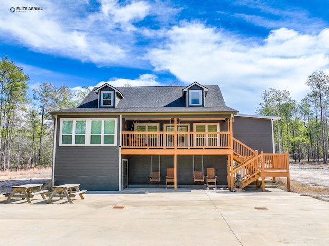 3535 Fm 1007, Brookeland, TX 75931 - back of house with a patio area, roof with shingles, and a deck