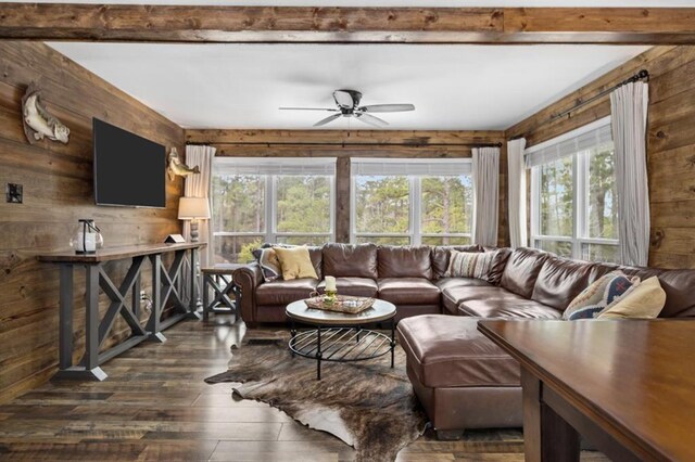 3535 Fm 1007, Brookeland, TX 75931 - living area featuring wooden walls, dark wood-style flooring, ceiling fan, and healthy amount of natural light