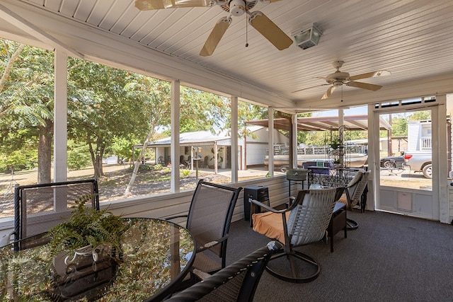 sunroom featuring a wealth of natural light and a ceiling fan