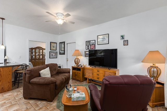 living room with a ceiling fan