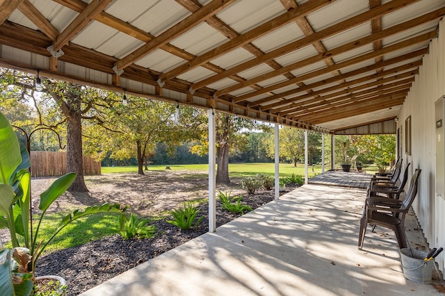 view of patio featuring fence