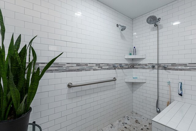 full bathroom with a tile shower