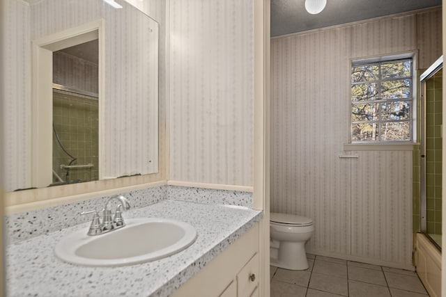 full bathroom featuring toilet, enclosed tub / shower combo, vanity, tile patterned floors, and a textured ceiling