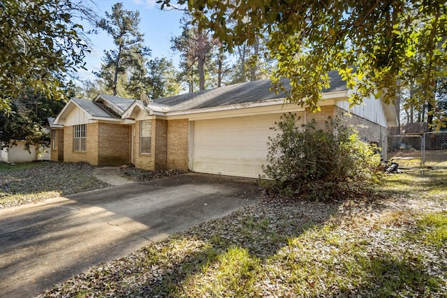 ranch-style house featuring a garage