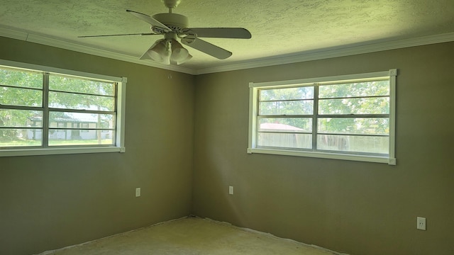 unfurnished room with a textured ceiling, ceiling fan, crown molding, and a wealth of natural light