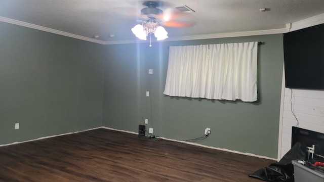 spare room featuring dark hardwood / wood-style floors, ceiling fan, and ornamental molding