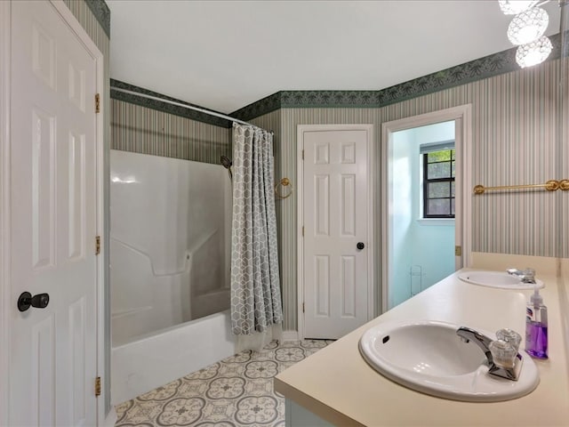602 April Dr, Lufkin, TX 75904 - bathroom with wallpapered walls, double vanity, shower / bath combination with curtain, and tile patterned floors