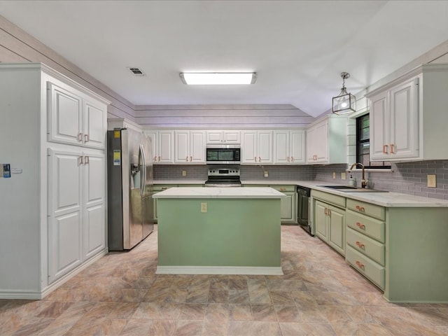 602 April Dr, Lufkin, TX 75904 - kitchen with appliances with stainless steel finishes, green cabinets, light countertops, backsplash, and lofted ceiling