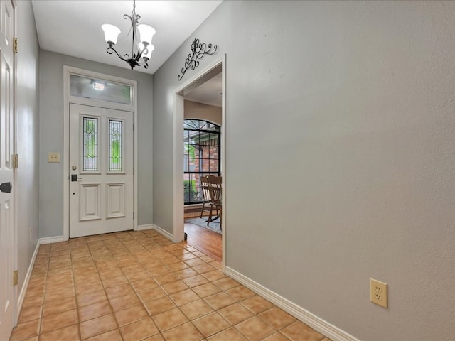 602 April Dr, Lufkin, TX 75904 - entryway with a chandelier and light tile patterned floors