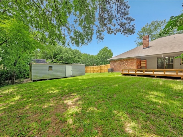 602 April Dr, Lufkin, TX 75904 - view of yard with an outdoor structure and a wooden deck