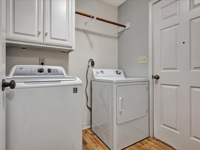 602 April Dr, Lufkin, TX 75904 - laundry room featuring independent washer and dryer, cabinet space, and light wood-style floors