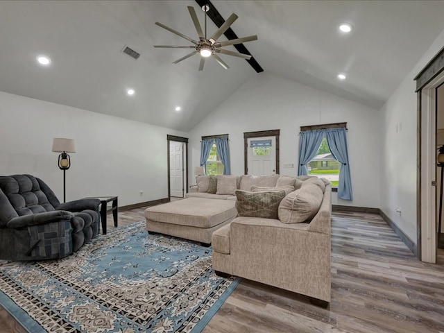516 Westchester St, Diboll, TX 75941 - living room featuring a ceiling fan, baseboards, wood finished floors, high vaulted ceiling, and beamed ceiling