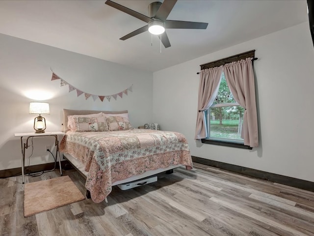 516 Westchester St, Diboll, TX 75941 - bedroom with baseboards, wood finished floors, and ceiling fan