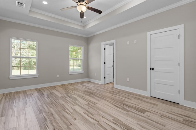 unfurnished room with light hardwood / wood-style flooring, a wealth of natural light, ornamental molding, and ceiling fan