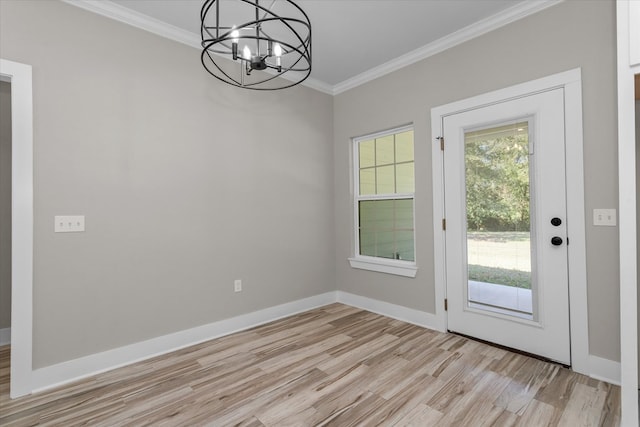 doorway to outside featuring light hardwood / wood-style floors, crown molding, and a notable chandelier