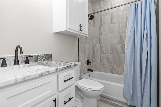 full bathroom featuring vanity, toilet, wood-type flooring, and shower / bathtub combination with curtain