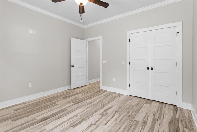 unfurnished bedroom with a closet, ceiling fan, light hardwood / wood-style flooring, and ornamental molding