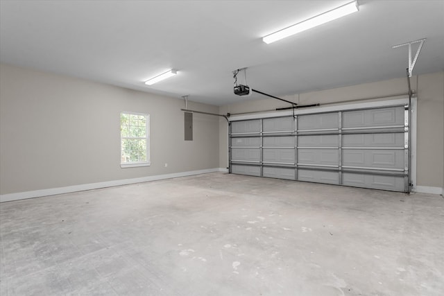 garage featuring electric panel and a garage door opener