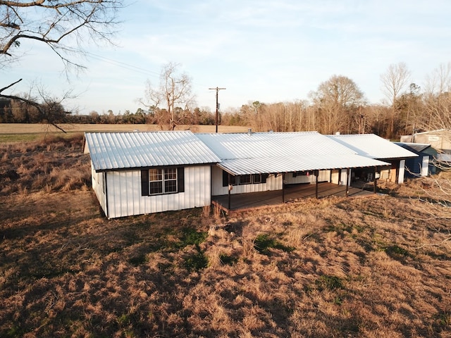 exterior space featuring metal roof