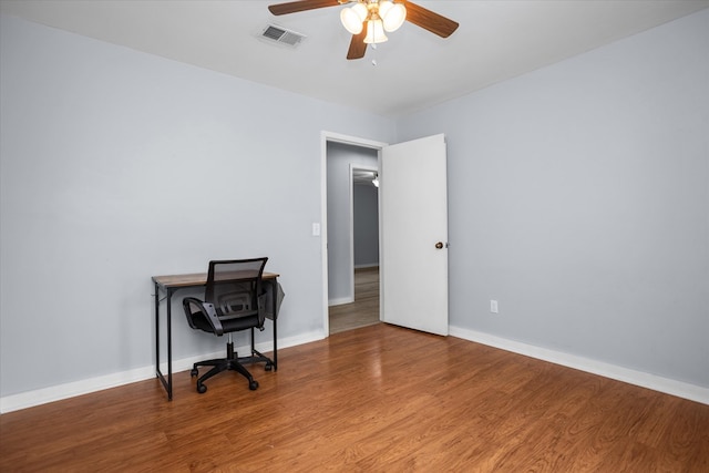 1504 Azalea Dr, Lufkin, TX 75904 - unfurnished office featuring a ceiling fan, wood finished floors, and baseboards