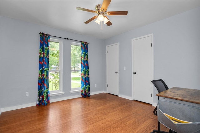 1504 Azalea Dr, Lufkin, TX 75904 - unfurnished office with wood finished floors, a ceiling fan, and baseboards
