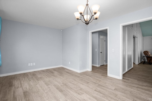 1504 Azalea Dr, Lufkin, TX 75904 - unfurnished room featuring a chandelier, light wood-style flooring, and baseboards