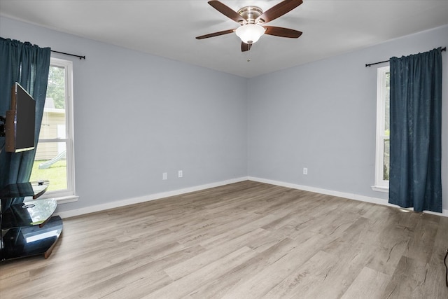 1504 Azalea Dr, Lufkin, TX 75904 - empty room featuring a ceiling fan, wood finished floors, and baseboards