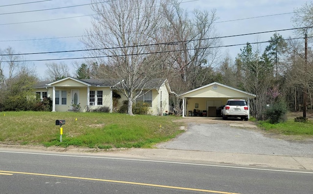 2606 Brentwood Dr, Lufkin, TX 75901 - ranch-style home with driveway, a detached carport, and a front yard