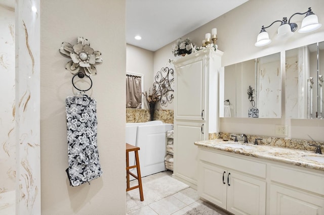 bathroom featuring tile patterned flooring and vanity