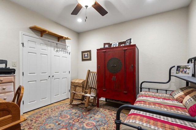 interior space featuring hardwood / wood-style flooring, ceiling fan, and a closet