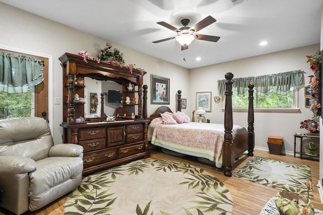 bedroom featuring ceiling fan and light hardwood / wood-style flooring