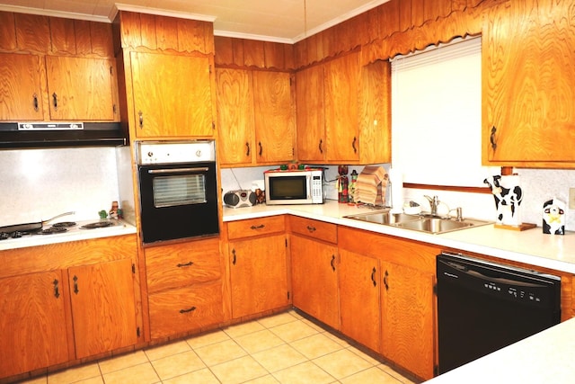 kitchen with black appliances, sink, ornamental molding, light tile patterned floors, and tasteful backsplash