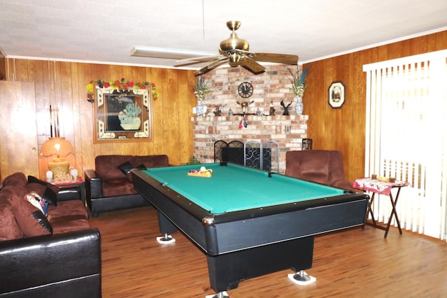 rec room with wood-type flooring, radiator, wooden walls, and pool table