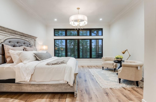 bedroom with ornamental molding, wood finished floors, recessed lighting, baseboards, and a chandelier