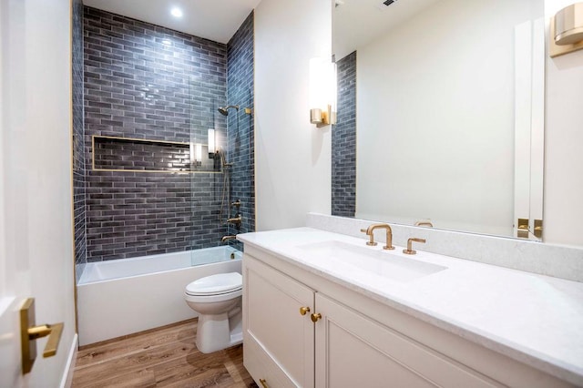 full bathroom featuring vanity,  shower combination, toilet, and wood finished floors