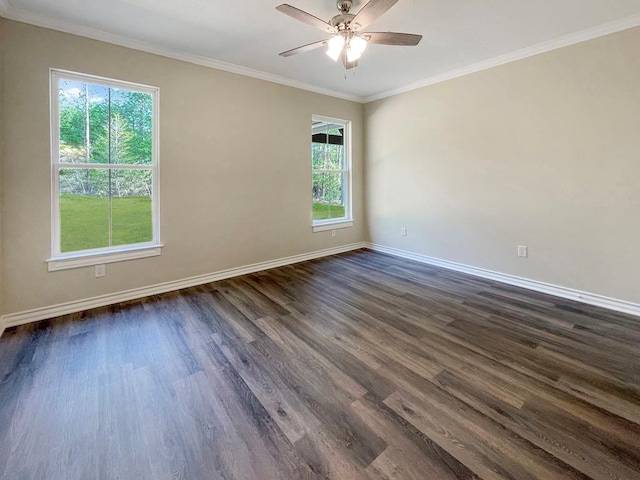 spare room featuring ornamental molding, a ceiling fan, baseboards, and dark wood-style flooring