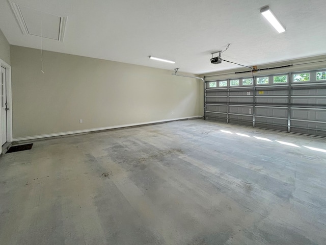 garage featuring baseboards and a garage door opener
