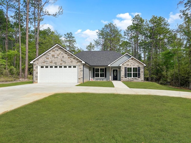 single story home featuring stone siding, an attached garage, driveway, and a front yard