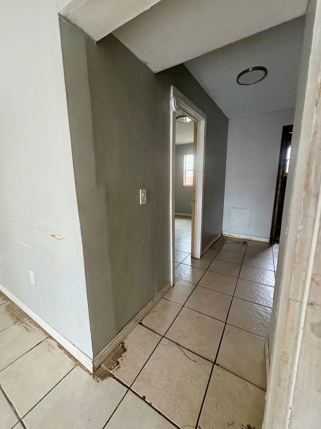 hallway featuring light tile patterned floors